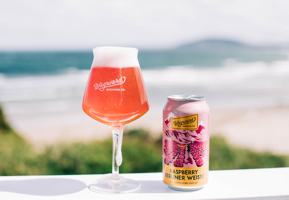 Raspberry Berliner Weisse can and glass at the beach