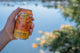 Hazy Mid can held up by the water