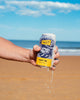 Hazy IPA can overflowing at the beach